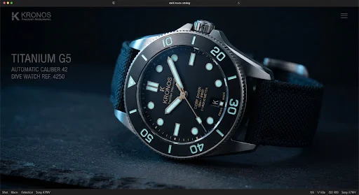 Technical luxury titanium diving watch photographed in extreme macro detail on a matte slate surface with dramatic cold rim lighting. The watch dial features high-contrast luminous indices, a brushed black ceramic rotating bezel, and a visible titanium Grade 5 case chamfered to satin perfection. Subtle gold and warm titanium accents emphasize Swiss horology precision.